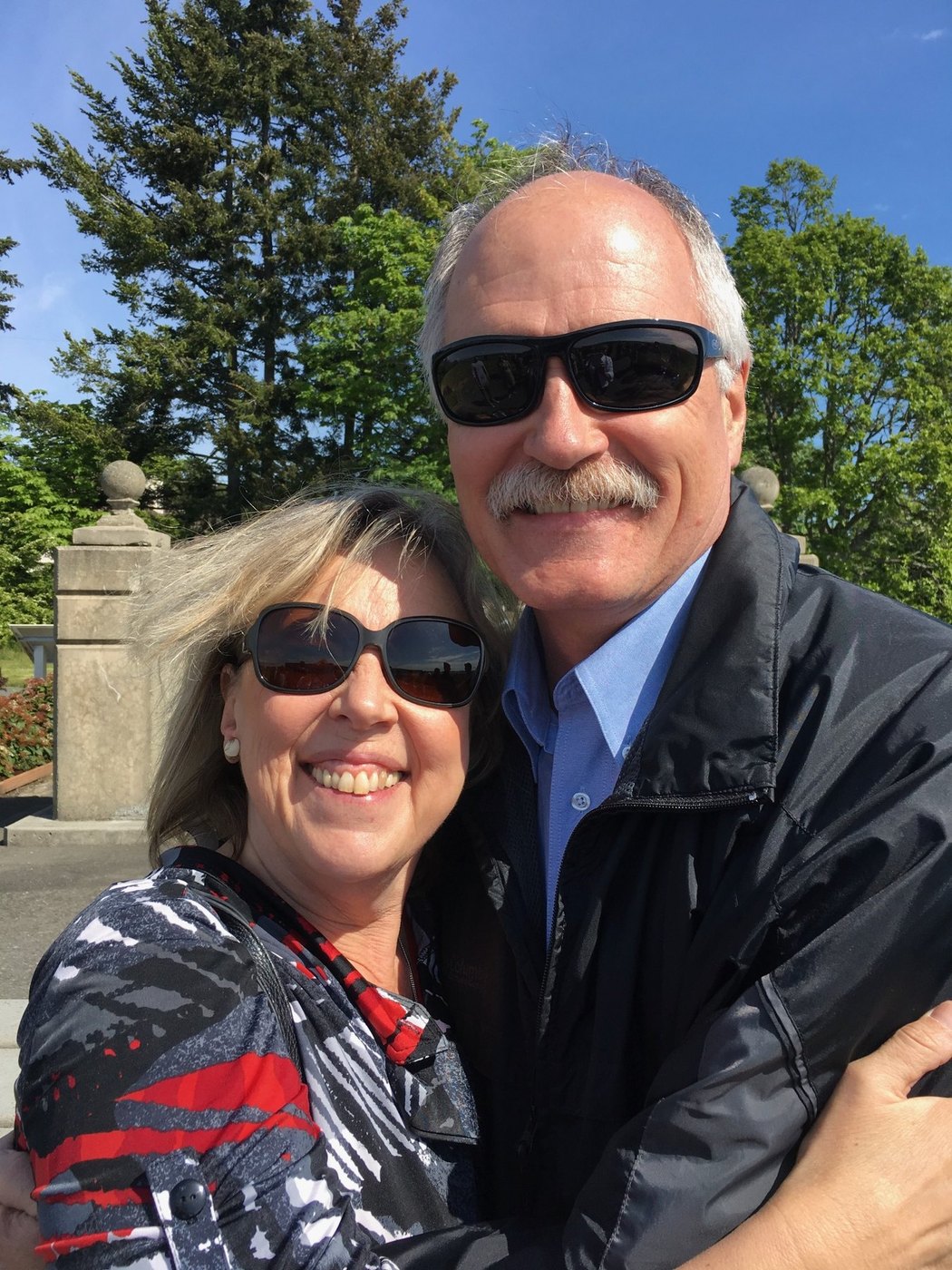 Jack McClintock with a public leader at a community event