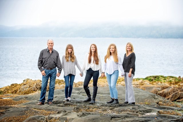 Jack McClintock with family beside the water