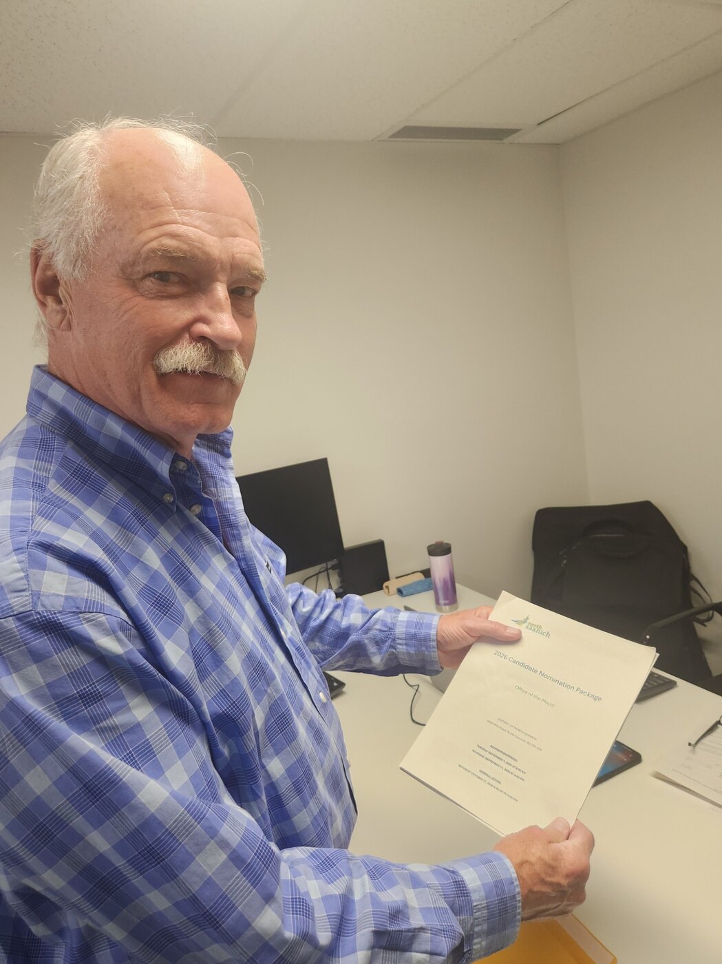 Jack McClintock holding his nomination package