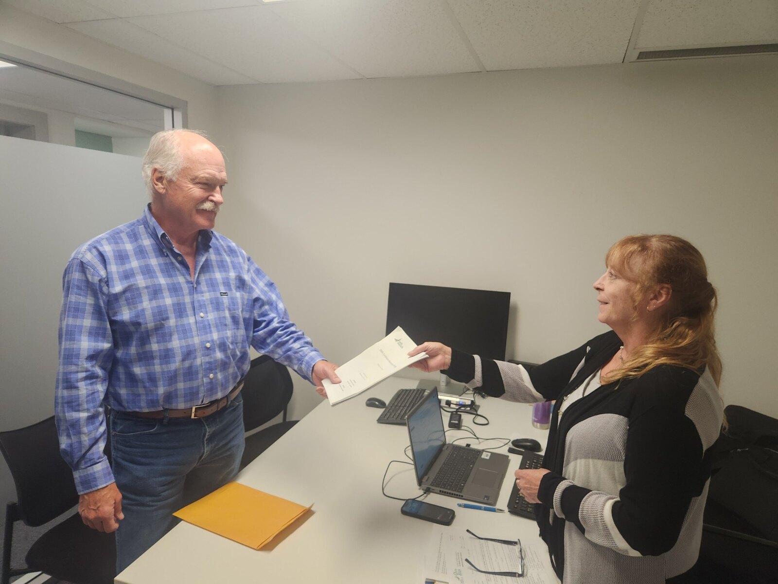 Jack McClintock completing the nomination document presentation